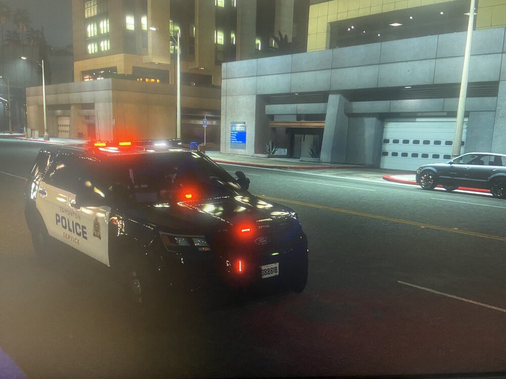 Could contain: vehicle, land vehicle, wheel, building, transport, text, automotive lighting, road, vehicle registration plate, mid-size car, automotive tail & brake light, outdoor, sports sedan, auto part, full-size car, tire, police, car, light, street, city