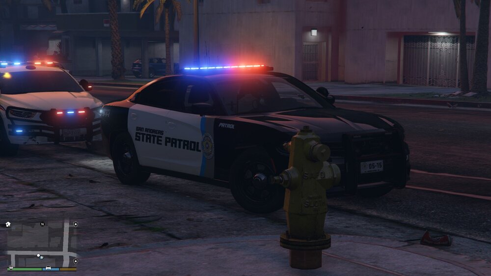 Could contain: vehicle, land vehicle, outdoor, wheel, text, tire, street, car, road, ground, police, light