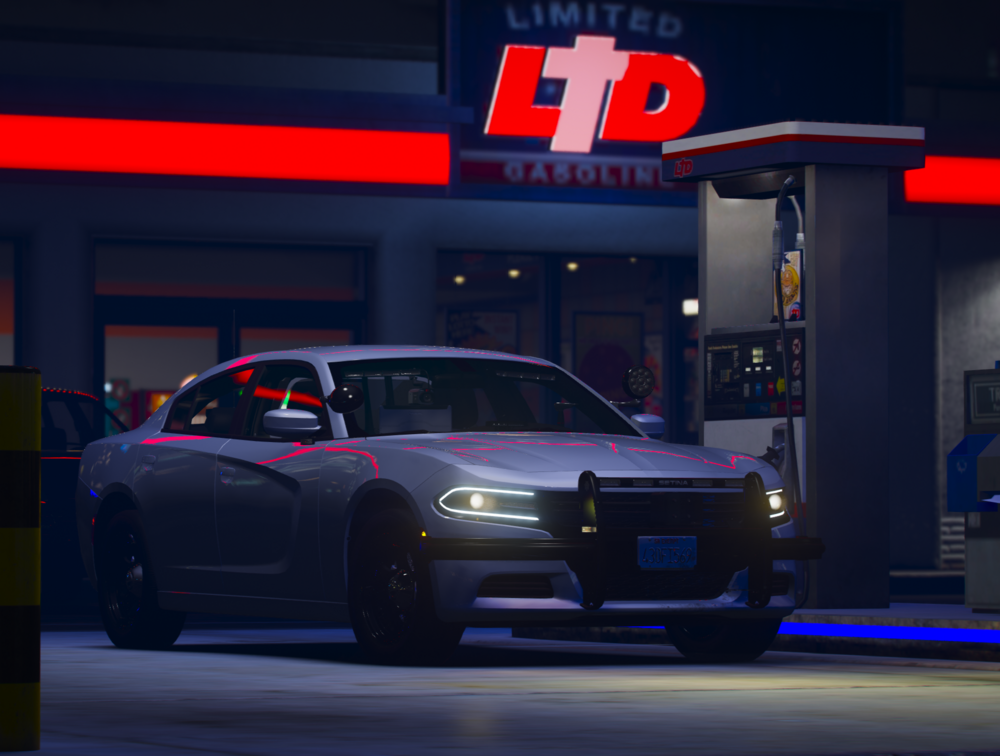 Could contain: vehicle, land vehicle, wheel, tire, automotive design, transport, automotive tail & brake light, text, mid-size car, road, automotive lighting, automotive exterior, auto part, night, outdoor, car, red, sign