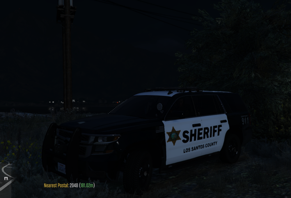 Could contain: vehicle, text, land vehicle, wheel, outdoor, tire, transport, auto part, automotive exterior, car, night, police, dark