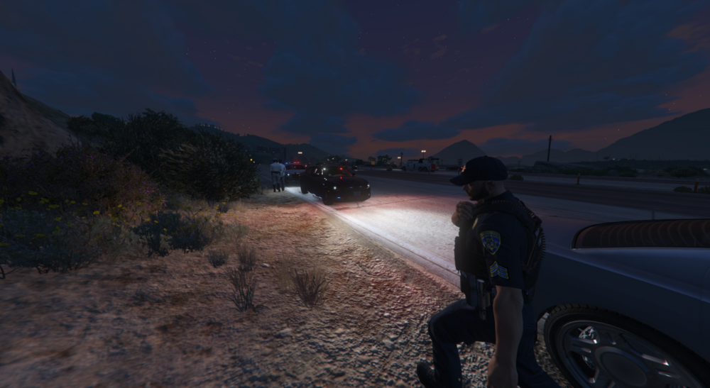 Could contain: outdoor, land vehicle, vehicle, sky, wheel, tire, person, ground, road, car, mountain