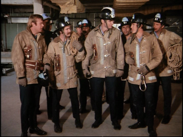 Could contain: person, clothing, group, footwear, human face, building, people, smile, standing, crew, man, security, organization, uniform, indoor, military uniform, wearing, posing