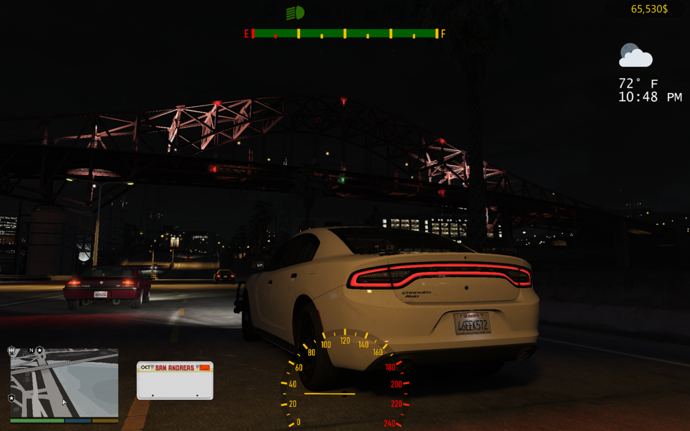 Could contain: text, vehicle, land vehicle, wheel, car, road, tire, night, outdoor