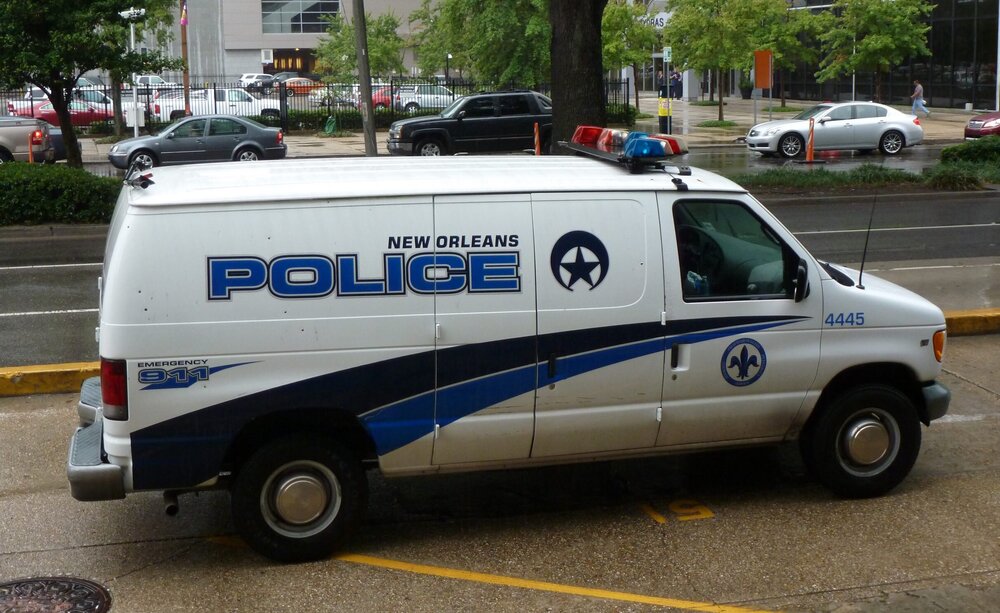 Could contain: vehicle, transport, land vehicle, wheel, outdoor, text, light commercial vehicle, van, motor vehicle, car, compact van, mode of transport, police, minivan, emergency vehicle, ford, minibus, tire, police van, ambulance, ford e-series, auto part, road, parked