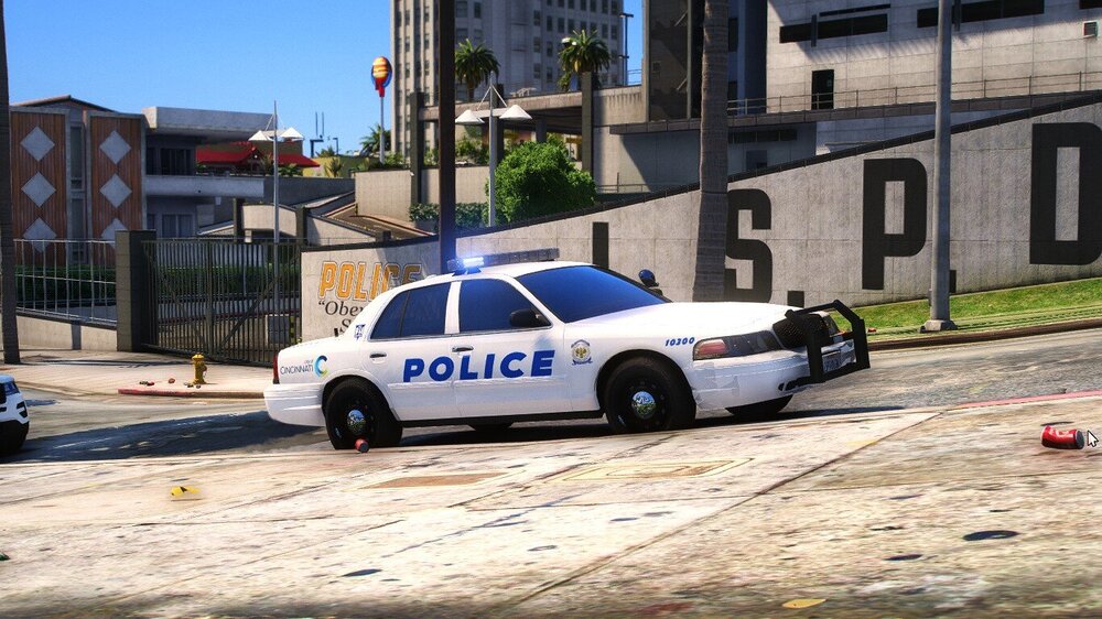 Could contain: vehicle, land vehicle, outdoor, wheel, transport, building, police car, law enforcement, full-size car, tire, ford crown victoria police interceptor, car, road, police, ground, street, parked