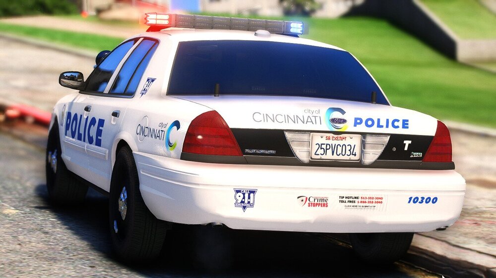 Could contain: text, vehicle, land vehicle, wheel, outdoor, transport, police car, vehicle registration plate, law enforcement, full-size car, police, car, tire, ford crown victoria police interceptor, ford, road, ground, street