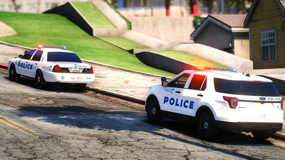 Could contain: vehicle, land vehicle, outdoor, wheel, transport, tire, road, police car, text, law enforcement, automotive exterior, car, ground, street, police, grass, parked