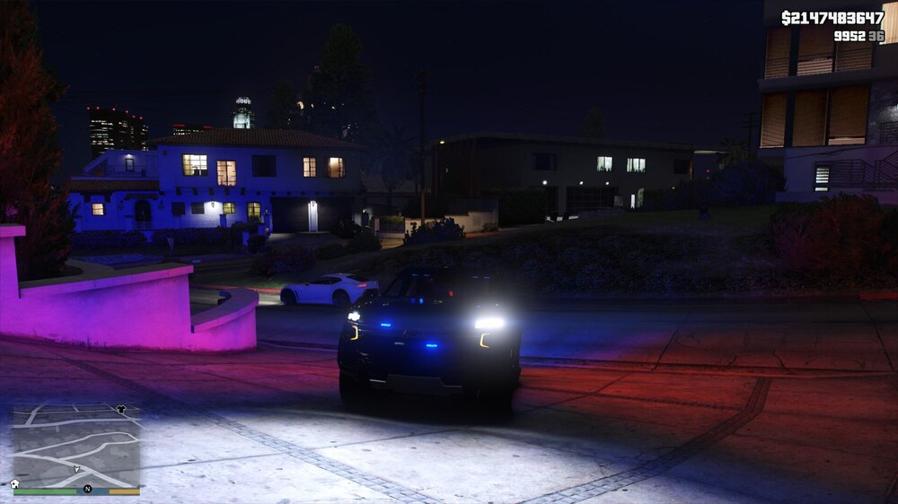 Could contain: outdoor, vehicle, car, land vehicle, screenshot, building, night, ground, street, light