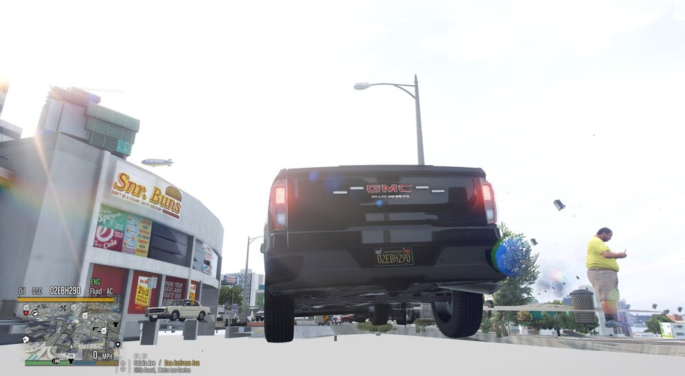 Could contain: sky, text, outdoor, land vehicle, wheel, tire, billboard, car, truck, road, vehicle, parked