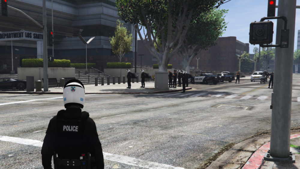 Could contain: outdoor, road, tree, land vehicle, crosswalk, vehicle, car, way, street, sidewalk, traffic sign, road surface, sky, signaling device, wheel, lane, asphalt, stop, person, ground, traffic light