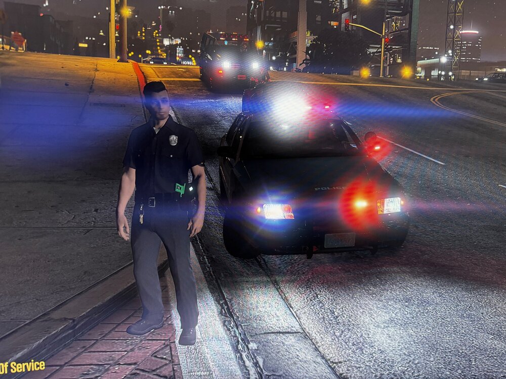 Could contain: outdoor, vehicle, land vehicle, car, clothing, road, person, footwear, text, street, man, ground, wheel, automotive lighting, light, city, way, night