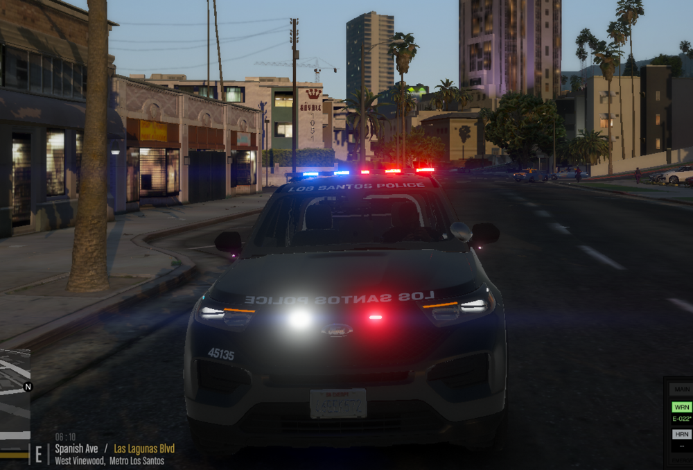 Could contain: vehicle, land vehicle, outdoor, text, car, building, road, sky, vehicle registration plate, automotive lighting, wheel, traffic, automotive tail & brake light, street, automotive exterior, city, police, light