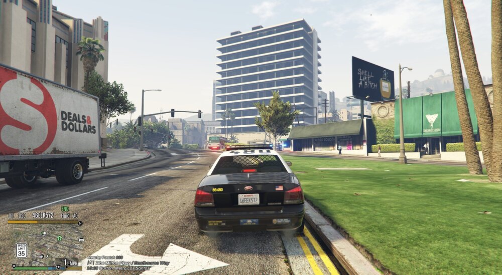 Could contain: outdoor, land vehicle, sky, vehicle, text, car, wheel, grass, tree, truck, transport, billboard, road, city, street