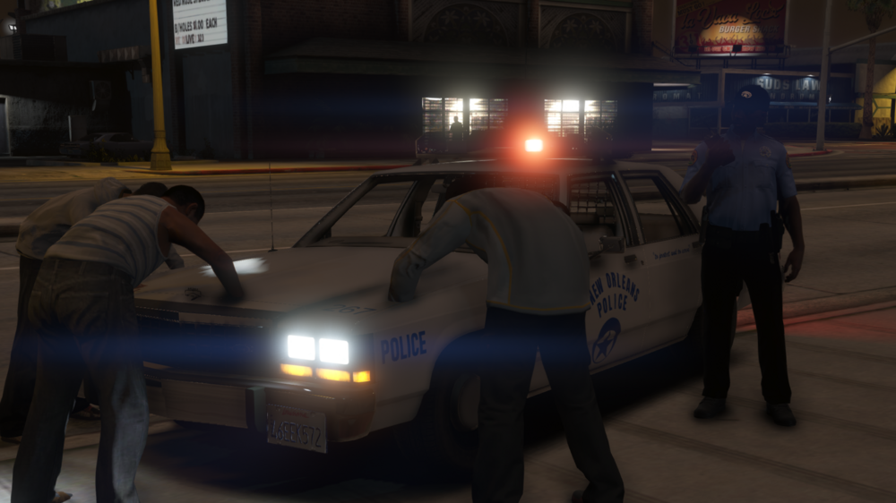 Could contain: vehicle, land vehicle, clothing, person, man, outdoor, transport, wheel, road, tire, law enforcement, officer, police, car, street