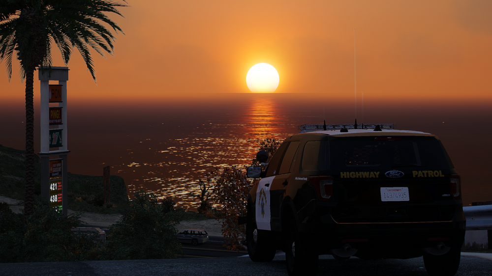 Could contain: outdoor, sky, vehicle, land vehicle, tree, wheel, tire, sunset, sunrise, water, transport, driving, sun