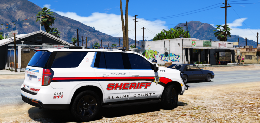 Could contain: vehicle, land vehicle, outdoor, wheel, sky, transport, car, text, tire, road, minivan, vehicle registration plate, mountain, emergency vehicle, motor vehicle, sport utility vehicle, police car, police, parked, van