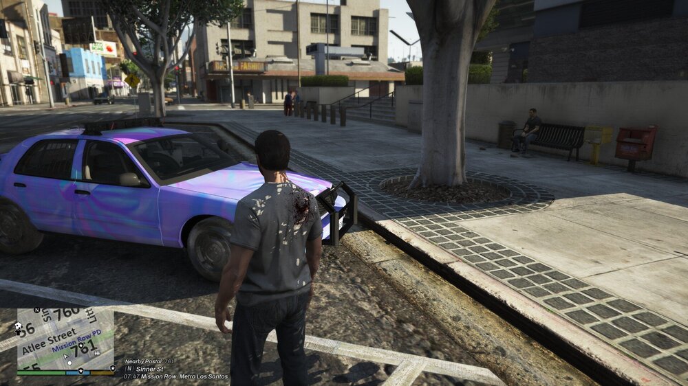 Could contain: vehicle, outdoor, land vehicle, wheel, clothing, building, ground, person, tire, footwear, man, car, purple, blue, street