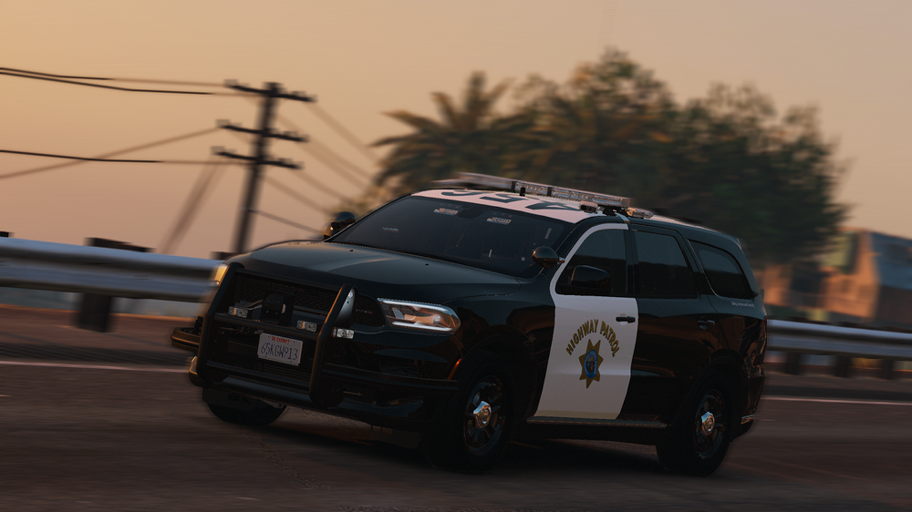 Could contain: vehicle, land vehicle, wheel, outdoor, sky, tire, road, auto part, transport, police, car, street, driving