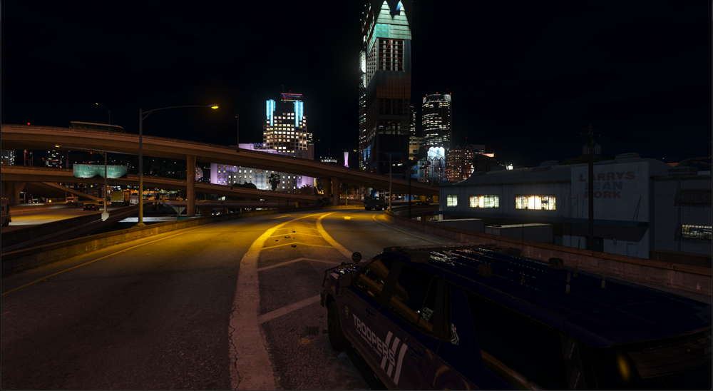 Could contain: outdoor, night, sky, road, skyscraper, metropolitan area, street light, city, building, vehicle, urban area, downtown, electricity, car, land vehicle, infrastructure, metropolis, street, light, tower, cityscape, bridge