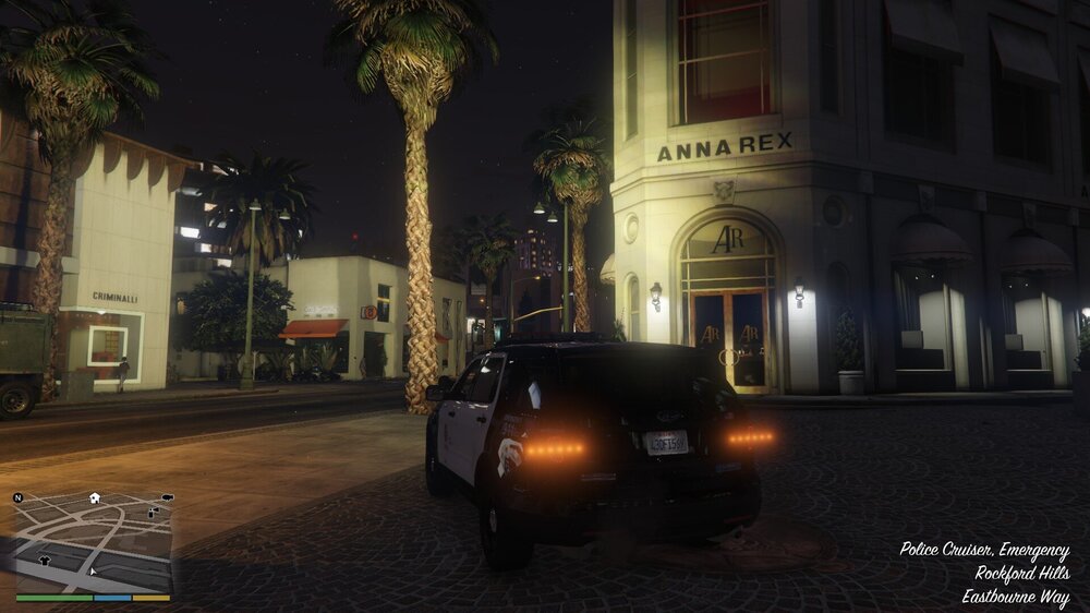 Could contain: land vehicle, vehicle, outdoor, wheel, building, tire, tree, car, palm tree, night, street, text, screenshot, road, palm, city, ground, light