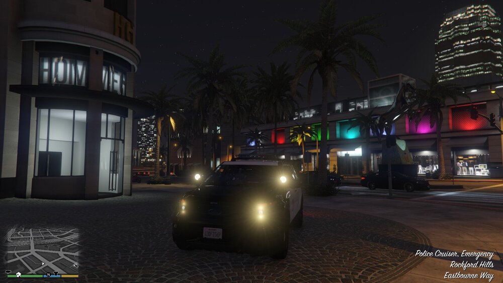 Could contain: vehicle, land vehicle, car, building, outdoor, sky, tree, street, palm, night, ground, city, light