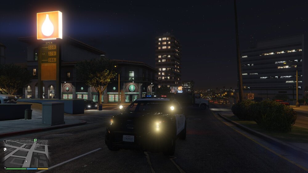 Could contain: outdoor, vehicle, land vehicle, sky, street light, building, road, night, wheel, car, light, street, city