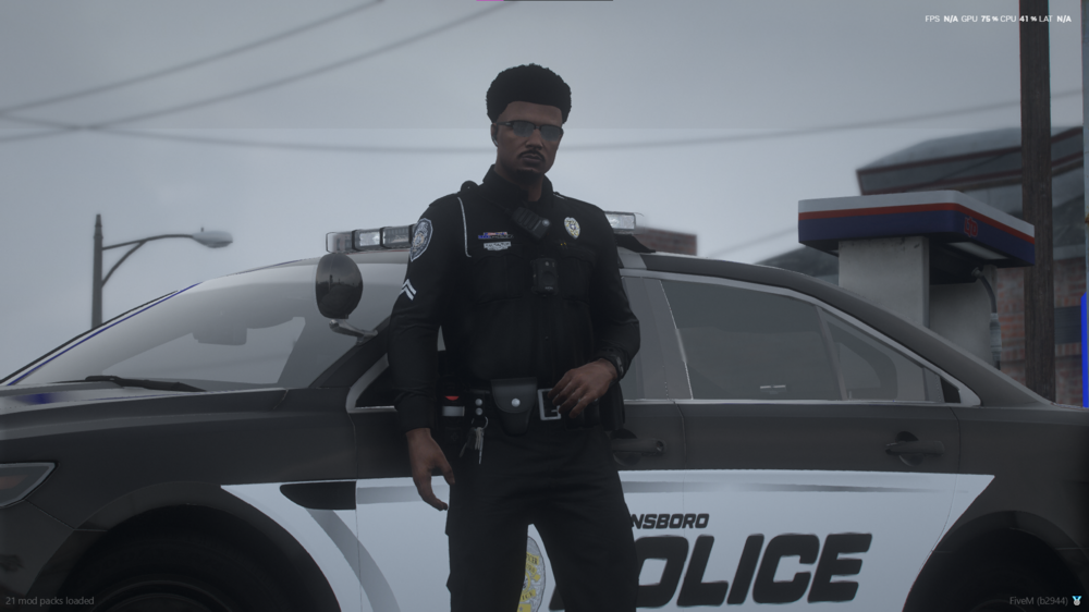 Could contain: vehicle, land vehicle, person, wheel, outdoor, clothing, tire, sky, law enforcement, man, auto part, police, officer, car