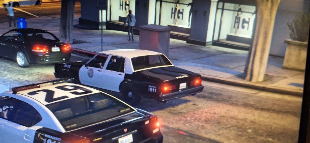 Could contain: vehicle, land vehicle, wheel, outdoor, tire, transport, road, vehicle registration plate, building, police, automotive tail & brake light, auto part, automotive exterior, automotive lighting, automotive parking light, automotive side marker light, street, sedan, car, ground, light, parked