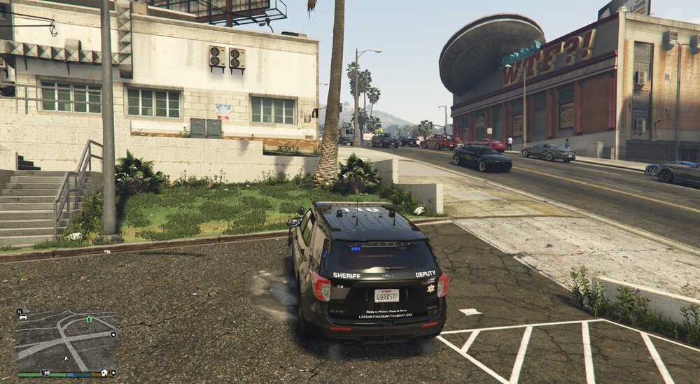 Could contain: outdoor, vehicle, land vehicle, wheel, sky, building, tire, road, car, vehicle registration plate, ground, way, street