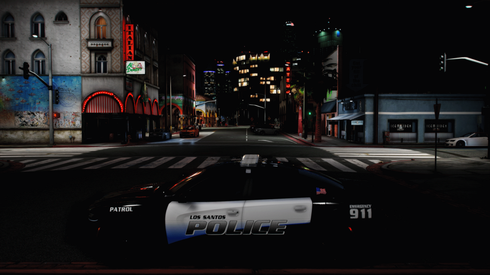 Could contain: outdoor, car, building, text, vehicle, land vehicle, street, road, billboard, night, electricity, light, sign, city, dark