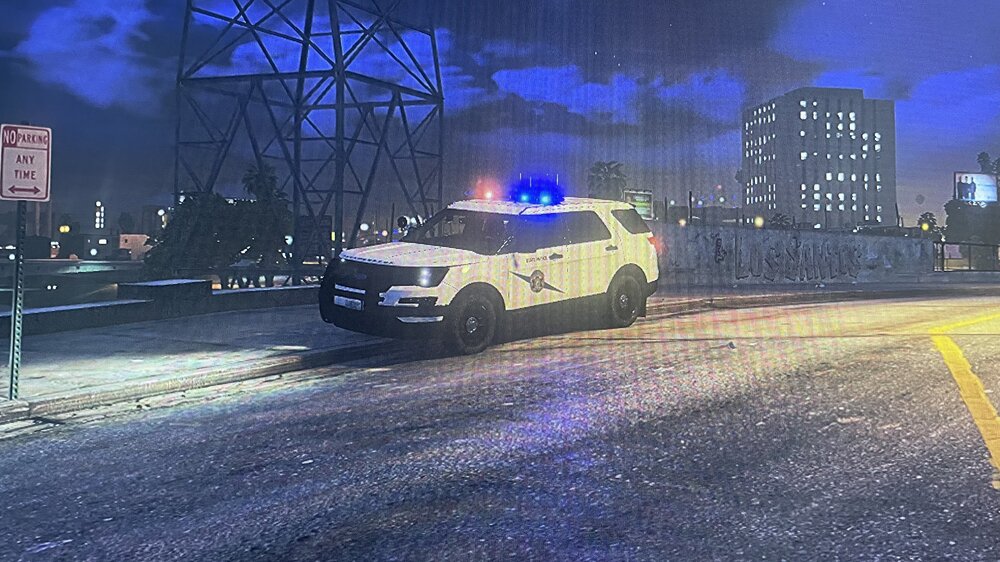 Could contain: outdoor, car, vehicle, land vehicle, skyscraper, building, road, sky, wheel, street, city, light, night, ground