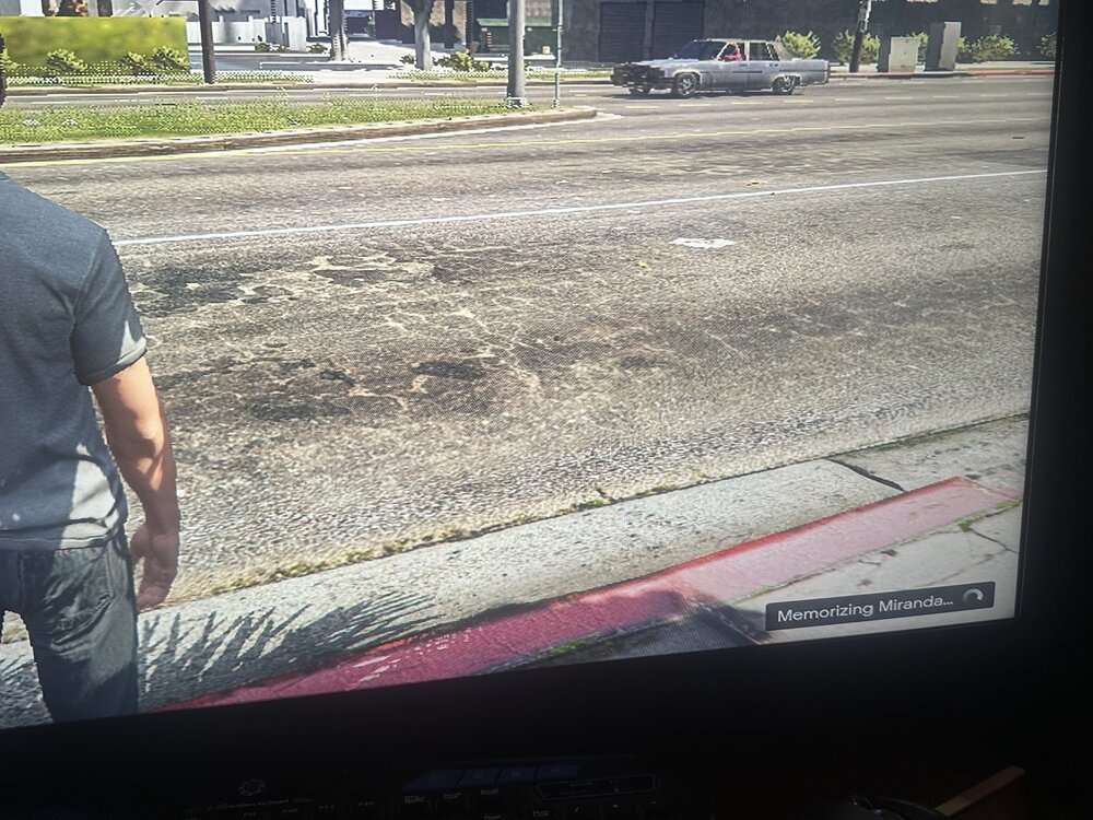 Could contain: outdoor, person, ground, clothing, land vehicle, vehicle, road, car, text, grass, street, window