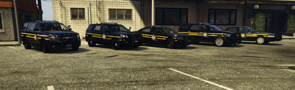 Could contain: land vehicle, outdoor, wheel, building, tire, road, emergency service, law enforcement, auto part, car, automotive exterior, vehicle registration plate, emergency vehicle, emergency, police, motor vehicle, street, parked, ground, vehicle