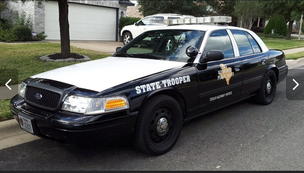 Could contain: vehicle, land vehicle, wheel, text, outdoor, tire, transport, vehicle registration plate, law enforcement, full-size car, police car, police, bumper, ford, auto part, ford crown victoria police interceptor, ford motor company, sedan, grille, motor vehicle, automotive exterior, volvo cars, car, parked