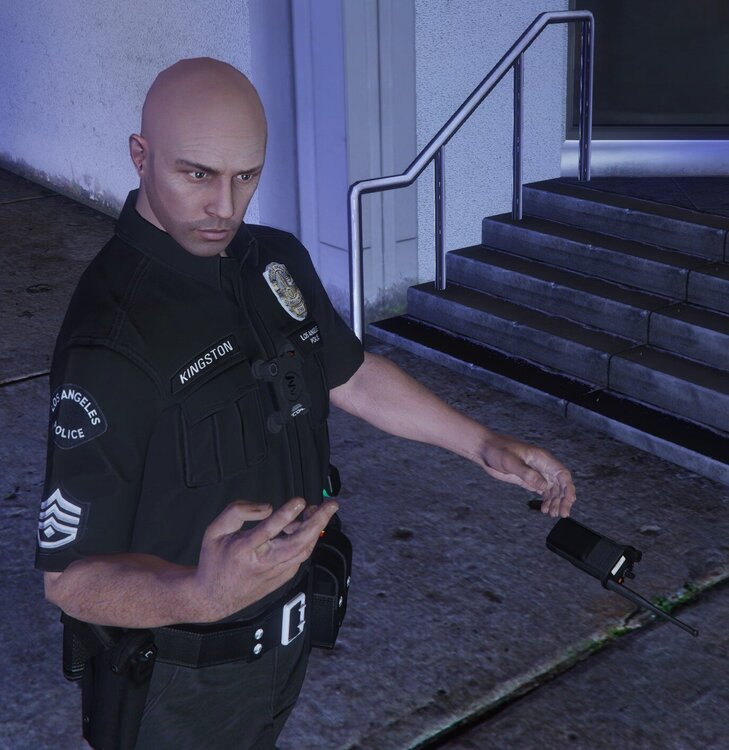 Could contain: person, clothing, man, human face, security, police officer, ground, outdoor