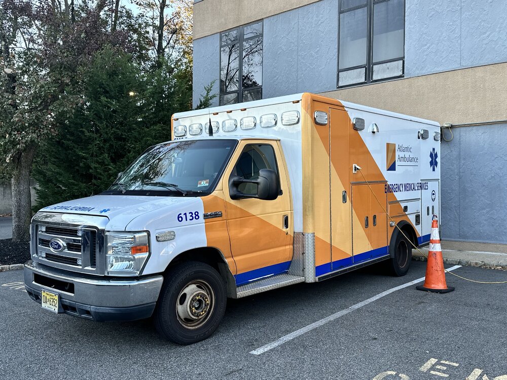 Could contain: vehicle, land vehicle, wheel, transport, outdoor, text, tire, light commercial vehicle, motor vehicle, auto part, emergency vehicle, vehicle registration plate, road, parked, van, truck, ground