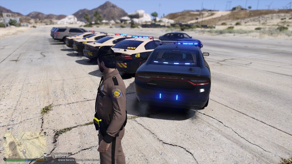 Could contain: outdoor, land vehicle, vehicle, wheel, tire, ground, car, road, auto part, person, mountain