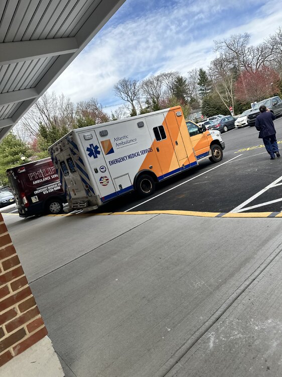 Could contain: sky, outdoor, vehicle, land vehicle, wheel, road, tire, tree, asphalt, road surface, tarmac, tar, car, truck, ground, person