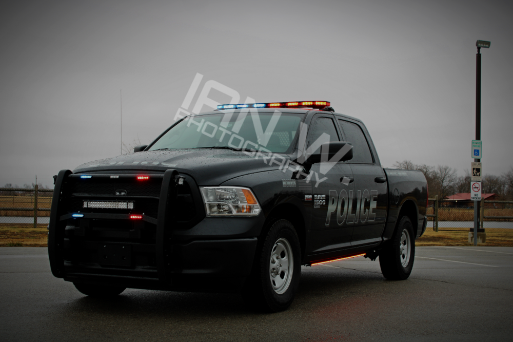 Could contain: vehicle, land vehicle, wheel, tire, sky, transport, outdoor, bumper, auto part, automotive exterior, automotive tire, truck, motor vehicle, pickup truck, sport utility vehicle, automotive design, automotive light bulb, ford, hood, mitsubishi, grille, road, automotive side marker light, police, car