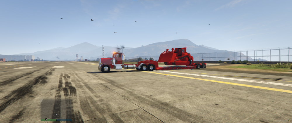 Could contain: sky, outdoor, vehicle, road, land vehicle, wheel, road surface, truck, tar, asphalt, tarmac, mountain, ground, construction