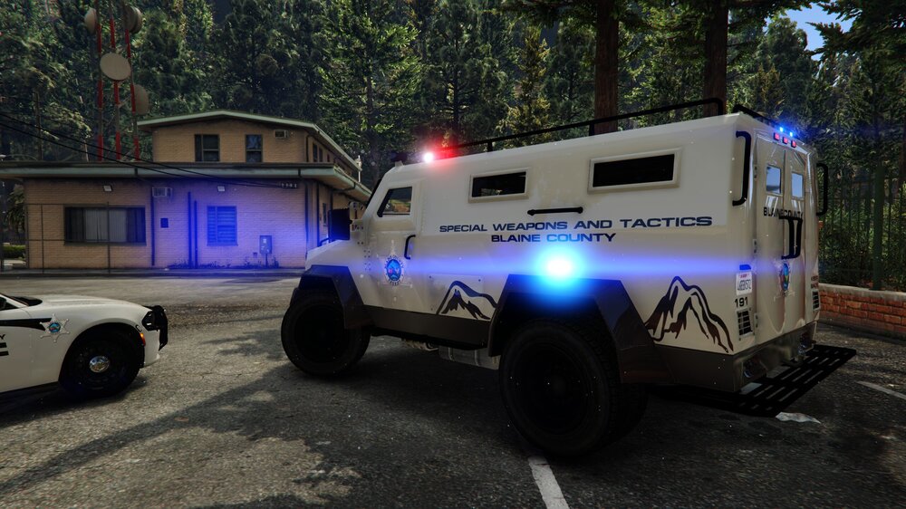 Could contain: transport, land vehicle, wheel, outdoor, tire, tree, truck, auto part, road, car, emergency vehicle, emergency service, automotive exterior, parked, ground, police, vehicle, light