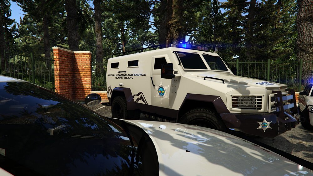 Could contain: vehicle, land vehicle, transport, outdoor, wheel, tire, tree, truck, auto part, car, automotive exterior, automotive tire, roof rack, parked, police