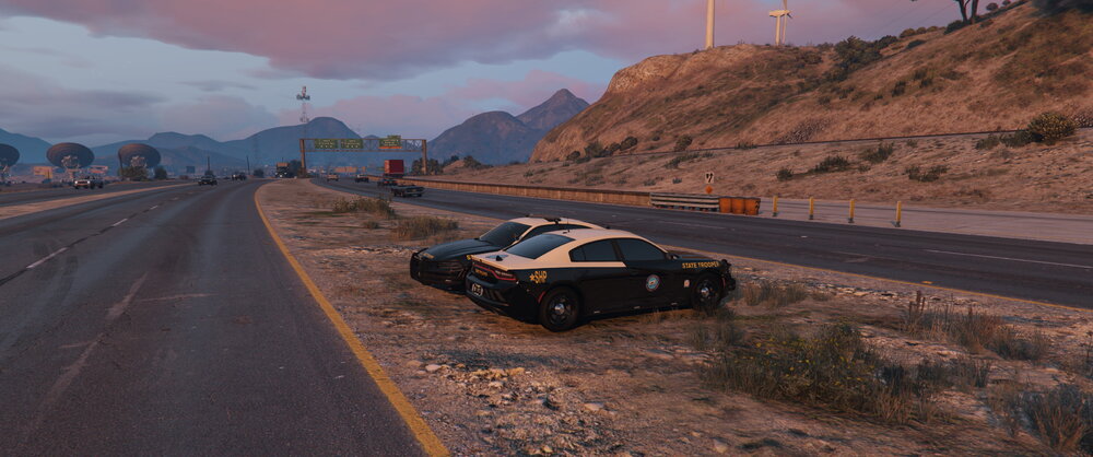 Could contain: outdoor, land vehicle, vehicle, sky, road, wheel, cloud, ground, transport, mountain, car, way, track, street