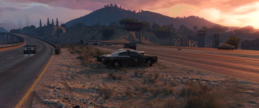 Could contain: outdoor, vehicle, land vehicle, sky, cloud, transport, wheel, road, car, mountain, military vehicle, sunset, ground, driving, desert, tank