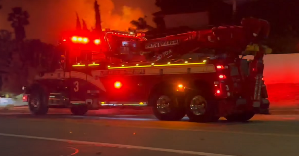 Could contain: fire, vehicle, land vehicle, firefighter, transport, wheel, emergency service, outdoor, fire department, truck, fire apparatus, emergency vehicle, road, emergency, rescue, auto part, red, street, light