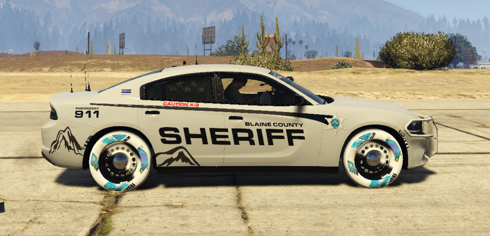 Could contain: vehicle, land vehicle, wheel, transport, tire, outdoor, motorsport, car, sports car, auto part, rim, ground, racing, mountain