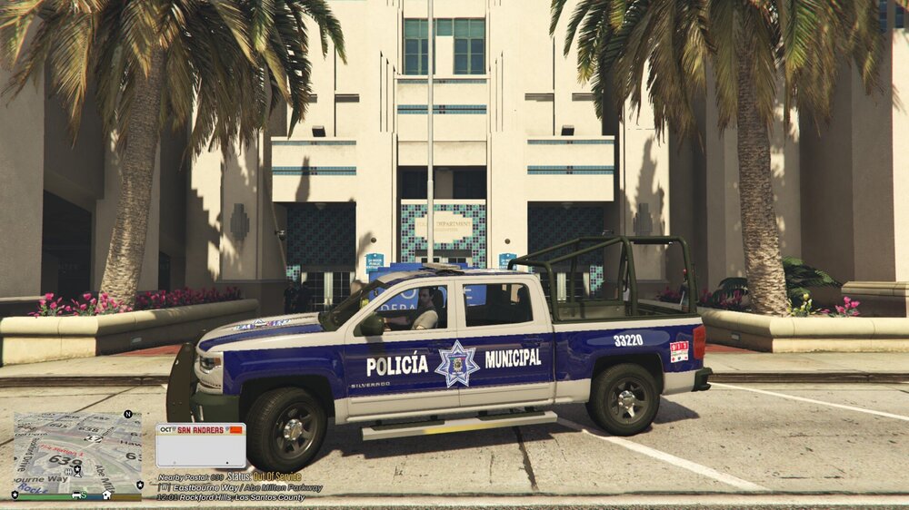 Could contain: vehicle, land vehicle, wheel, outdoor, transport, tire, building, tree, law enforcement, road, text, street, police, car, parked