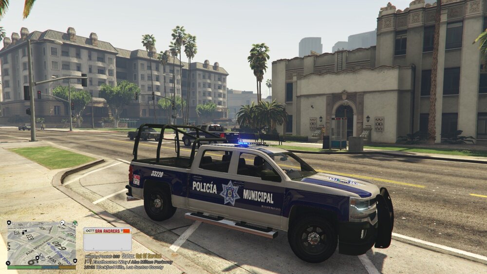 Could contain: vehicle, wheel, land vehicle, transport, outdoor, tire, building, text, car, law enforcement, road, police, officer