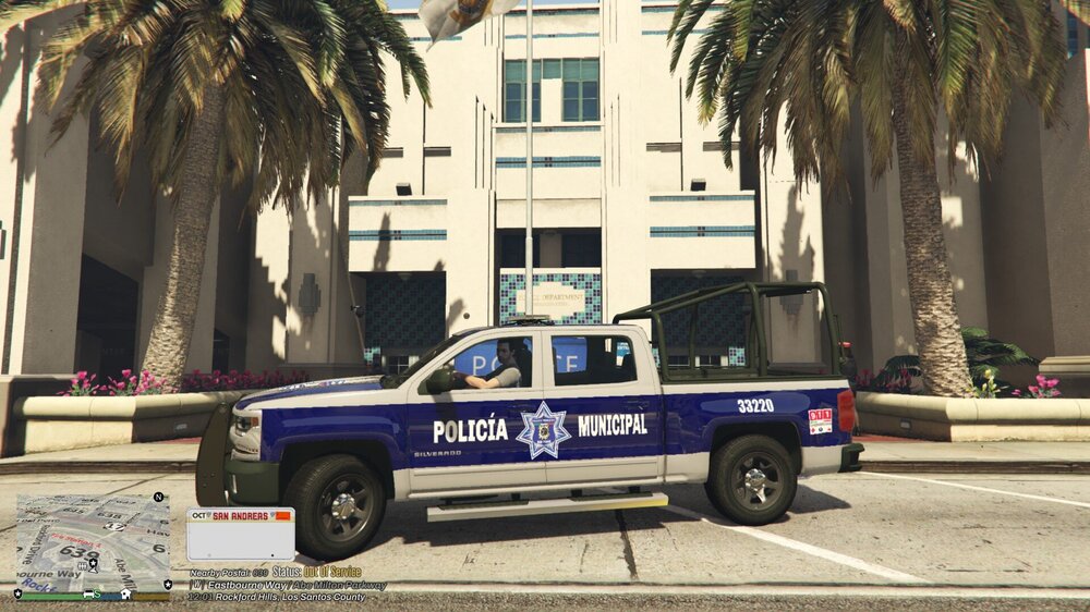 Could contain: vehicle, wheel, land vehicle, outdoor, transport, building, tire, tree, car, truck, road, text, street, palm, police, parked
