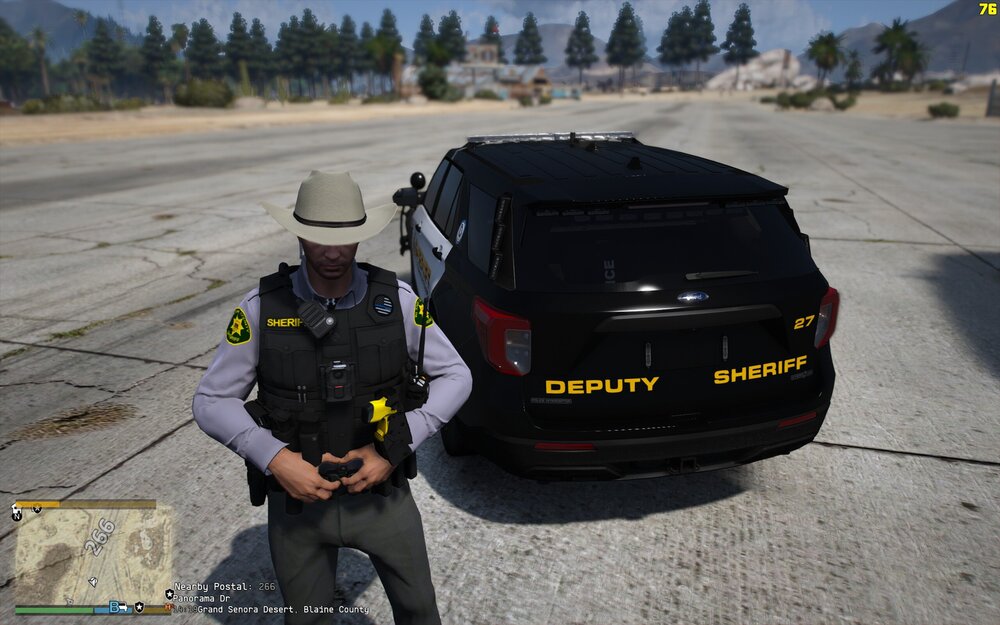 Could contain: outdoor, vehicle, land vehicle, wheel, clothing, person, tire, sky, car, text, road, auto part, ground, officer